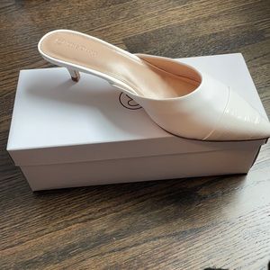 The drop size 11 kitten heel white mule